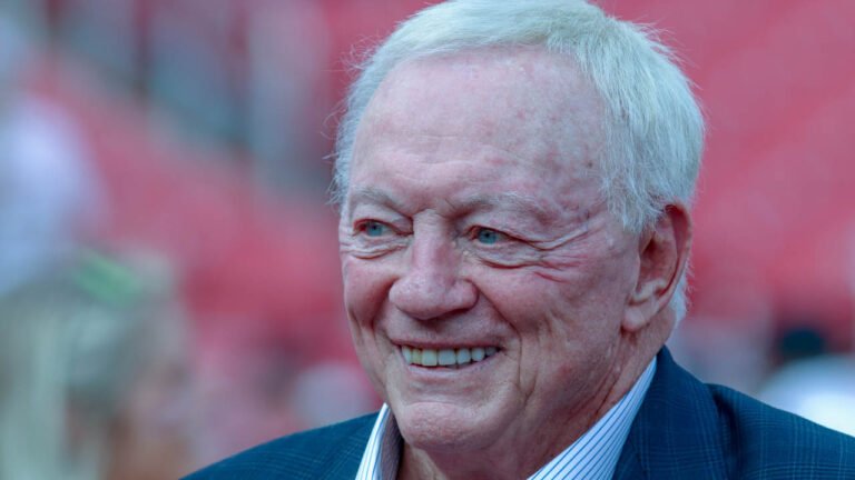 Cowboys owner Jerry Jones on Razorback Stadium field before an Arkansas-Texas game
