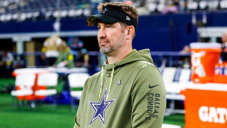 Cowboys coach Brian Schottenheimer on the sidelines during a workout